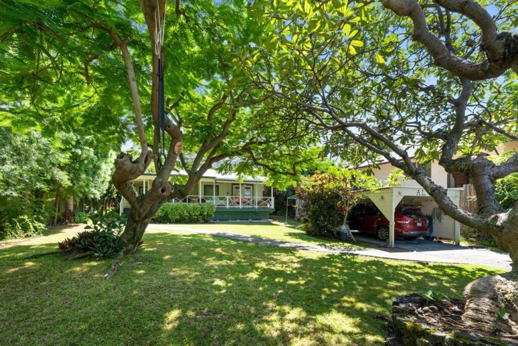 Keala Kai home and shaded tropical front lawn