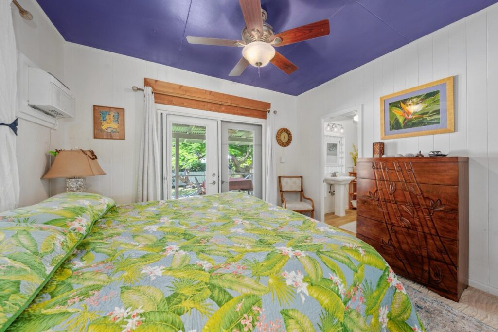 Primary bedroom with tropical garden view